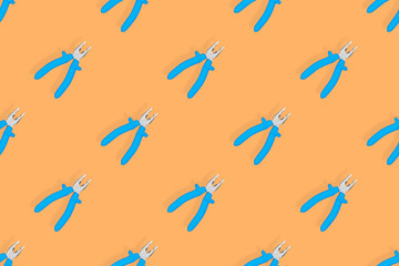 Pliers seamless pattern. Metal pliers with rubber grips.