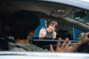 Beautiful asian thai woman waiting for her boyfriend to pick her up at home.