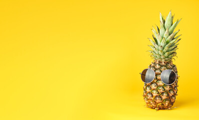 Pineapple with glasses summer on yellow background © Exploder