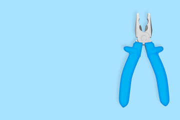 Metal pliers with rubber grips Background on the theme of tools, repair or maintenance of equipment.