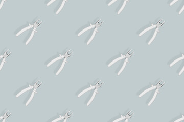 Pliers seamless pattern. Metal pliers with rubber grips.