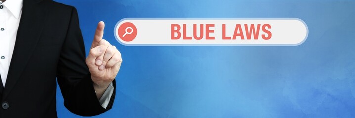 Blue Laws. Lawyer (man) points with his finger to an internet browser. Text is in the search box. Blue Background.