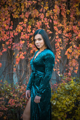 Woman in vintage style, blue velvet dress and retro accessorize 