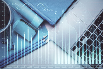 Double exposure of forex graph drawing over desktop background with computer. Concept of financial analysis. Top view.