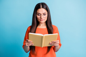 Obraz premium Photo of confident person hands holding book reading eyewear isolated on pastel blue color background