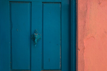 abstract blue door with elephant door bell 