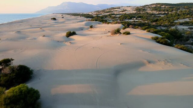 beautiful sand dunes on sea coast, aerial view of sea shore at sunset in Patara, Mediterranean Sea coast, natural beauty background