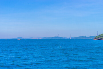 Hon Thom island in Phu Quoc, Vietnam, Asia - Tropical view with colorful houses, blue waves and blue sky, fishing boats and far away is a longest cable car