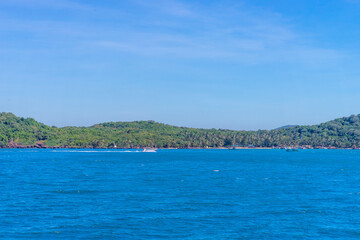 Hon Thom island in Phu Quoc, Vietnam, Asia - Tropical view with colorful houses, blue waves and blue sky, fishing boats and far away is a longest cable car