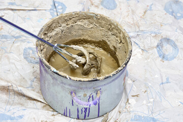 mixing the solution in container. construction, repair