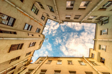 Ancient high-rise courtyards of the sky of St. Petersburg.A typical courtyard in the old district of Saint-Petersburg, view from the bottom up