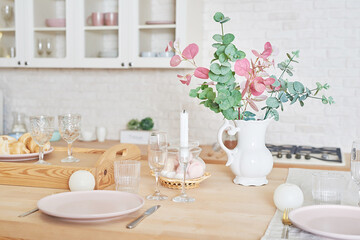White kitchen in interior loft style. Valentine's day kitchen decor. Kitchen utensils and shelves.