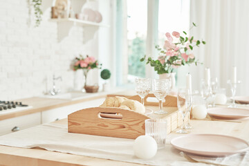 White kitchen in interior loft style. Valentine's day kitchen decor. Kitchen utensils and shelves.