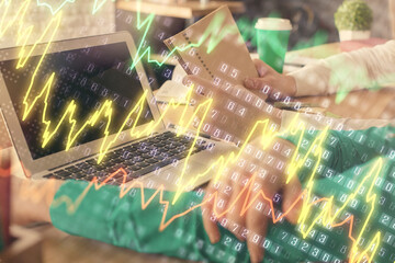 Double exposure of man and woman working together and forex chart hologram. Business concept. Computer background.