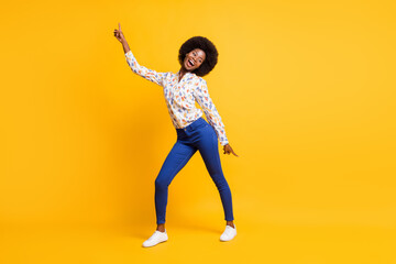 Fototapeta na wymiar Full length photo of cute adorable dark skin lady dressed casual outfit dancing pointing fingers isolated yellow color background