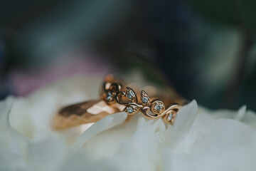 Beautiful wedding rings on flower bouquet-details. 
