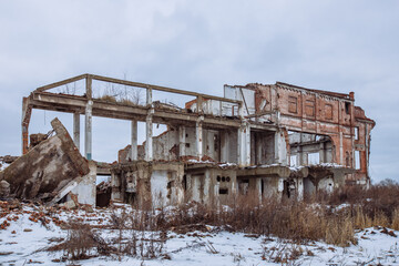 Remains of demolished old industrial building. Pile of stones, bricks and debris