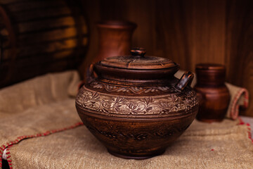 Ceramic clay brown terracotta pot. A clay pitcher with a pattern in stock. Various clay ceramic pot