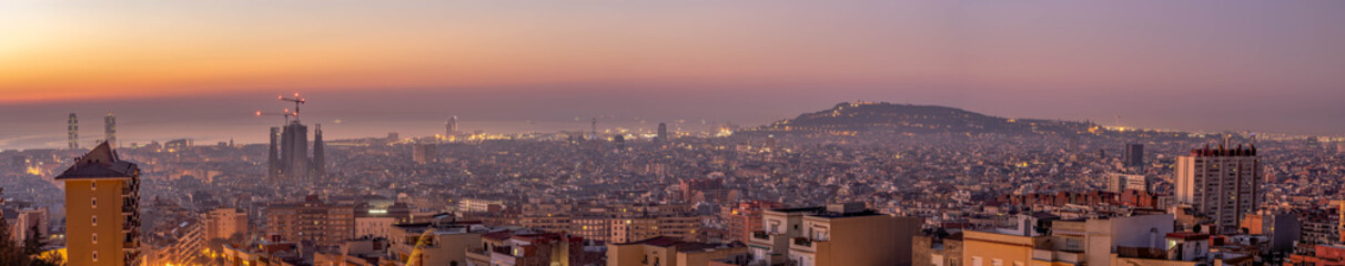 Panoramic view of Barcenoloa city skyline city lights in morning glow before sunrise