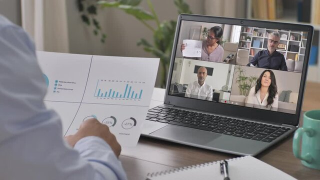 diverse business people having a video call conference on laptop screen,back view of male using computer chat application to discuss,share company results with colleagues co-workers