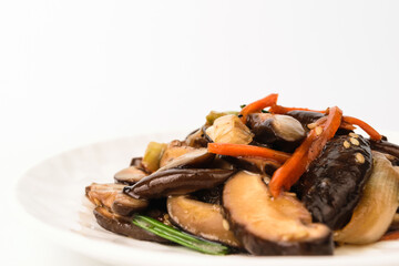 Stir-fried mushrooms on a white background