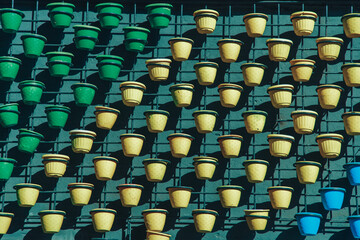 Fototapeta premium many flower pots in yellow and green