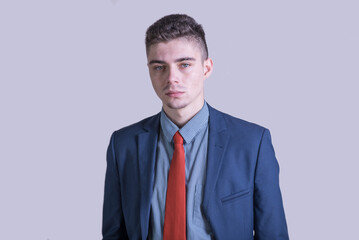 Portrait of a young and stylish boy in a suit