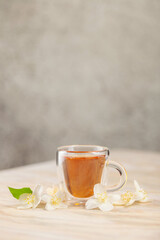 Tea with jasmine in a glass cup. Ceremony concept.