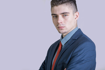 Portrait of a young and stylish boy in a suit