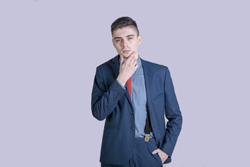 Portrait of a young and stylish boy in a suit