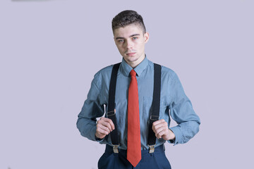 Portrait of a young and stylish boy in a suit