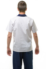 Fototapeta premium A man in a medical shirt and pants, a view from the back