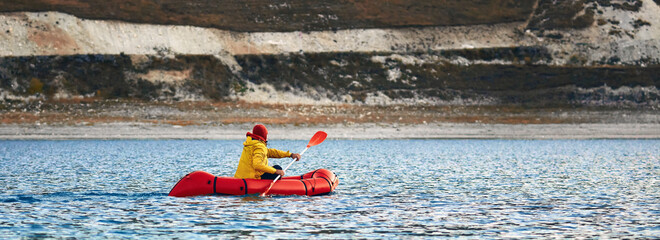 Swim in Packraft. Packraft, one-person light raft, used for expedition or adventure racing on a...