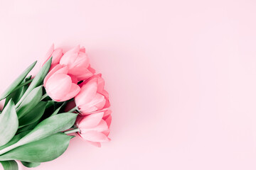 Beautiful composition spring flowers. Bouquet of pink tulips flowers on pastel pink background. Valentine's Day, Easter, Birthday, Happy Women's Day, Mother's Day. Flat lay, top view, copy space © prime1001