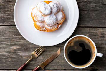 cup of coffee and cake on wooden table