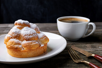 cup of coffee and cake on wooden table