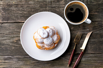 cup of coffee and cake on wooden table