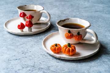 Handmade Ceramic Coffee or Tea Cups with Pumpkin and Mushroom Pattern Figure Design Handcrafted. Handicraft.