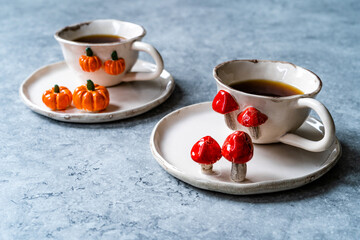 Handmade Ceramic Coffee or Tea Cups with Pumpkin and Mushroom Pattern Figure Design Handcrafted. Handicraft.