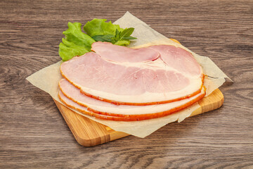 Sliced pork belly over board