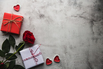 Valentine's Day, Gift box with a ribbon, candles and rose. - 405448417