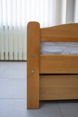 Fototapeta na wymiar single bed with mattress and drawers