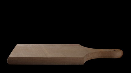 Wooden chopping board for cutting isolated on black background with clipping path