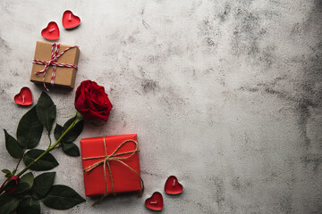 Valentine's Day, Gift box with a ribbon, candles and rose.