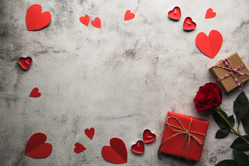 Valentine's Day, Gift box with a ribbon, candles and paper hearts. - 405450095