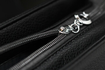 Close up of black leather bag zipper, black leather bag close up