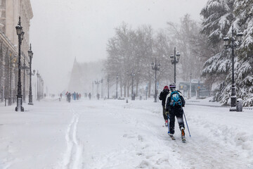 MADRID, SPAIN - JANUARY 09, 2021 - people enjoying the streets of snow, in the city of Madrid, covered by the storm philomena, january 05, 2021 in Madrid