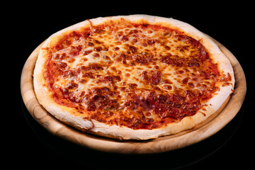 Tasty pizza made with pepperoni and ham, served on a wood board. Mozzarella topping melted on top. Isolated on black background.Professional photography.