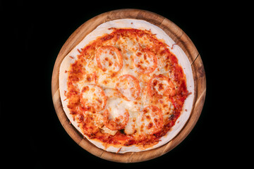 Tasty pizza made with grilled chicken and  tomatoes, served on a wood board. Mozzarella topping melted on top. Isolated on black background. Top view. Free space for text. Professional photography.
