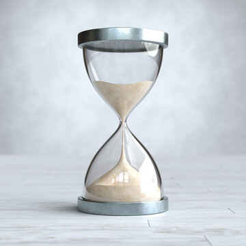 Hourglass on Wooden floor, sandglass.
